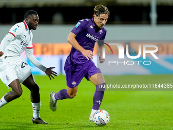 Youssouf Fofana of AC Milan and Edoardo Bove of ACF Fiorentina compete for the ball during the Serie A Enilive match between ACF Fiorentina...