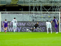 David De Gea of ACF Fiorentina saves the penalty kick of Theo Hernandez of AC Milan during the Serie A Enilive match between ACF Fiorentina...