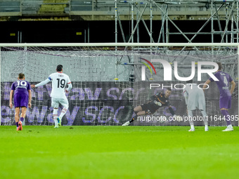 David De Gea of ACF Fiorentina saves the penalty kick of Theo Hernandez of AC Milan during the Serie A Enilive match between ACF Fiorentina...