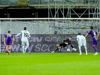 David De Gea of ACF Fiorentina saves the penalty kick of Theo Hernandez of AC Milan during the Serie A Enilive match between ACF Fiorentina...