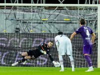 David De Gea of ACF Fiorentina saves the penalty kick of Theo Hernandez of AC Milan during the Serie A Enilive match between ACF Fiorentina...