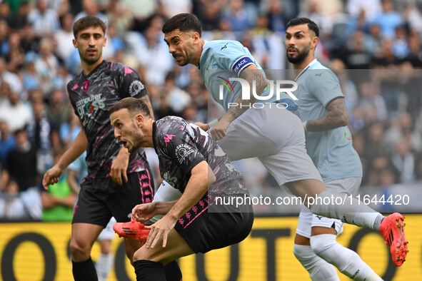 Ardian Ismajli of Empoli F.C. and Mattia Zaccagni of S.S. Lazio are in action during the 7th day of the Serie A Championship between S.S. La...