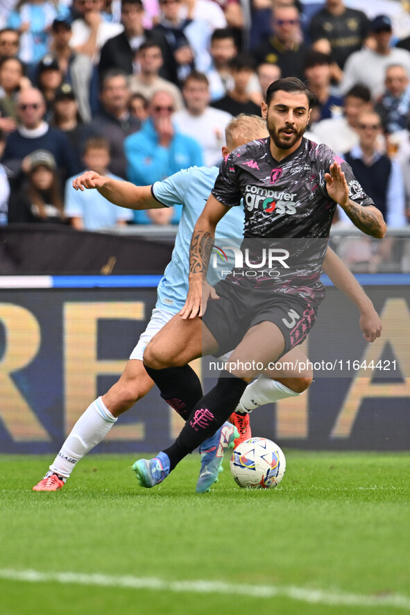 Giuseppe Pezzella of Empoli F.C. and Gustav Isaksen of S.S. Lazio are in action during the 7th day of the Serie A Championship between S.S....