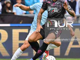 Giuseppe Pezzella of Empoli F.C. and Gustav Isaksen of S.S. Lazio are in action during the 7th day of the Serie A Championship between S.S....