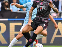 Giuseppe Pezzella of Empoli F.C. and Gustav Isaksen of S.S. Lazio are in action during the 7th day of the Serie A Championship between S.S....