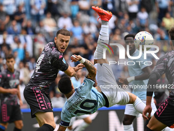 Ardian Ismajli of Empoli F.C. and Mattia Zaccagni of S.S. Lazio are in action during the 7th day of the Serie A Championship between S.S. La...