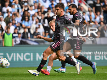 Gustav Isaksen of S.S. Lazio, Mattia Viti, and Giuseppe Pezzella of Empoli F.C. are in action during the 7th day of the Serie A Championship...