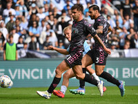 Gustav Isaksen of S.S. Lazio, Mattia Viti, and Giuseppe Pezzella of Empoli F.C. are in action during the 7th day of the Serie A Championship...