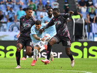 Tino Anjorin of Empoli F.C., Mattia Zaccagni of S.S. Lazio, and Emmanuel Gyasi of Empoli F.C. are in action during the 7th day of the Serie...