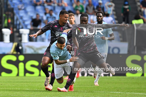 Tino Anjorin of Empoli F.C., Mattia Zaccagni of S.S. Lazio, and Emmanuel Gyasi of Empoli F.C. are in action during the 7th day of the Serie...