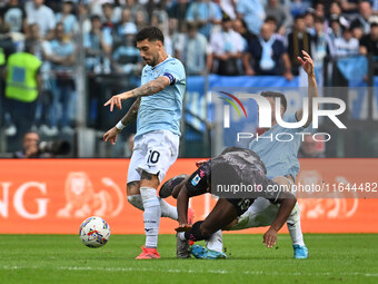 Mattia Zaccagni of S.S. Lazio, Emmanuel Ekong of Empoli F.C., and Mario Gila of S.S. Lazio are in action during the 7th day of the Serie A C...