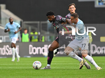 Emmanuel Ekong of Empoli F.C. and Adam Marusic of S.S. Lazio are in action during the 7th day of the Serie A Championship between S.S. Lazio...