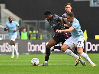 Emmanuel Ekong of Empoli F.C. and Adam Marusic of S.S. Lazio are in action during the 7th day of the Serie A Championship between S.S. Lazio...