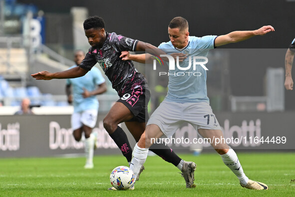 Emmanuel Ekong of Empoli F.C. and Adam Marusic of S.S. Lazio are in action during the 7th day of the Serie A Championship between S.S. Lazio...