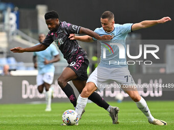 Emmanuel Ekong of Empoli F.C. and Adam Marusic of S.S. Lazio are in action during the 7th day of the Serie A Championship between S.S. Lazio...