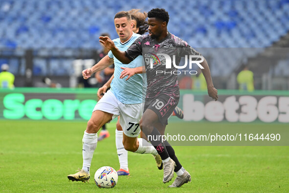 Emmanuel Ekong of Empoli F.C. and Adam Marusic of S.S. Lazio are in action during the 7th day of the Serie A Championship between S.S. Lazio...