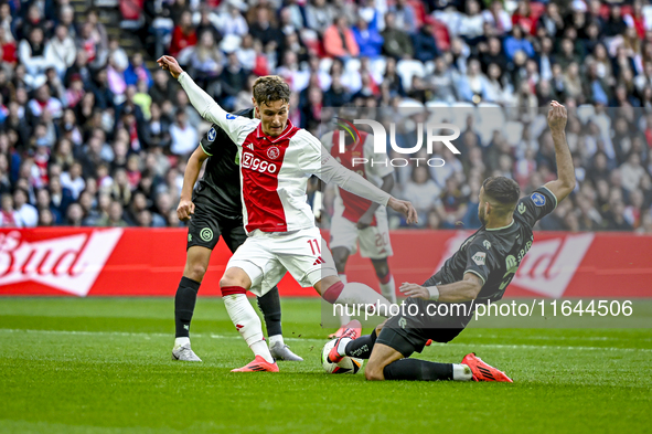 AFC Ajax Amsterdam forward Mika Godts and FC Groningen defender Marco Rente play during the match between Ajax and Groningen at the Johan Cr...