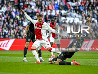 AFC Ajax Amsterdam forward Mika Godts and FC Groningen defender Marco Rente play during the match between Ajax and Groningen at the Johan Cr...