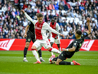 AFC Ajax Amsterdam forward Mika Godts and FC Groningen defender Marco Rente play during the match between Ajax and Groningen at the Johan Cr...