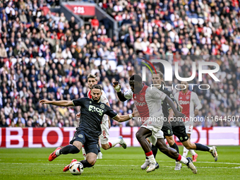 FC Groningen defender Marco Rente and AFC Ajax Amsterdam forward Brian Brobbey play during the match between Ajax and Groningen at the Johan...