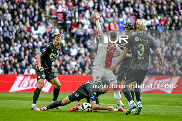 FC Groningen defender Marco Rente and AFC Ajax Amsterdam forward Mika Godts participate in the match between Ajax and Groningen at the Johan...