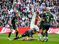 FC Groningen defender Marco Rente and AFC Ajax Amsterdam forward Mika Godts participate in the match between Ajax and Groningen at the Johan...