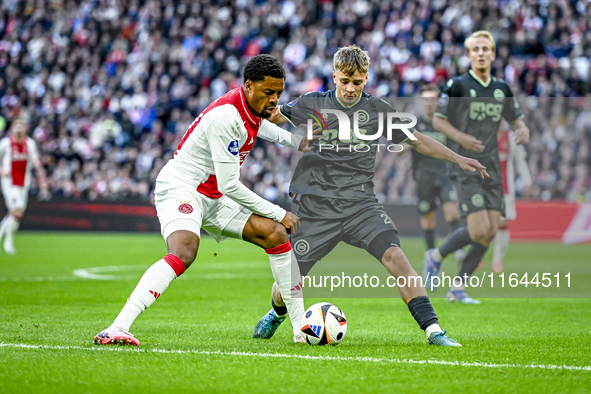 AFC Ajax Amsterdam forward Chuba Akpom and FC Groningen defender Wouter Prins play during the match between Ajax and Groningen at the Johan...