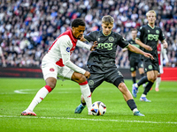 AFC Ajax Amsterdam forward Chuba Akpom and FC Groningen defender Wouter Prins play during the match between Ajax and Groningen at the Johan...