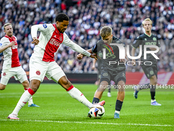 AFC Ajax Amsterdam forward Chuba Akpom and FC Groningen defender Wouter Prins play during the match between Ajax and Groningen at the Johan...