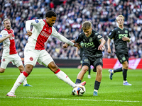 AFC Ajax Amsterdam forward Chuba Akpom and FC Groningen defender Wouter Prins play during the match between Ajax and Groningen at the Johan...