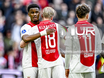 AFC Ajax Amsterdam defender Jorrel Hato and AFC Ajax Amsterdam midfielder Davy Klaassen participate in the match between Ajax and Groningen...