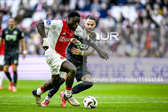 AFC Ajax Amsterdam forward Brian Brobbey and FC Groningen defender Marco Rente play during the match between Ajax and Groningen at the Johan...