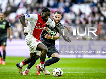 AFC Ajax Amsterdam forward Brian Brobbey and FC Groningen defender Marco Rente play during the match between Ajax and Groningen at the Johan...