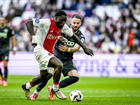 AFC Ajax Amsterdam forward Brian Brobbey and FC Groningen defender Marco Rente play during the match between Ajax and Groningen at the Johan...