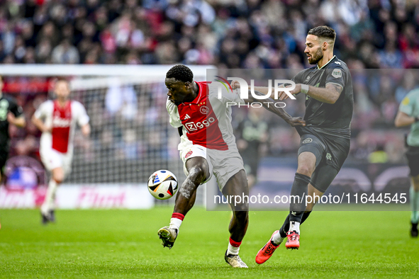 AFC Ajax Amsterdam forward Brian Brobbey and FC Groningen defender Marco Rente play during the match between Ajax and Groningen at the Johan...