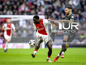 AFC Ajax Amsterdam forward Brian Brobbey and FC Groningen defender Marco Rente play during the match between Ajax and Groningen at the Johan...