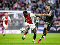 AFC Ajax Amsterdam forward Brian Brobbey and FC Groningen defender Marco Rente play during the match between Ajax and Groningen at the Johan...