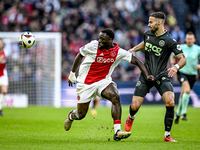 AFC Ajax Amsterdam forward Brian Brobbey and FC Groningen defender Marco Rente play during the match between Ajax and Groningen at the Johan...