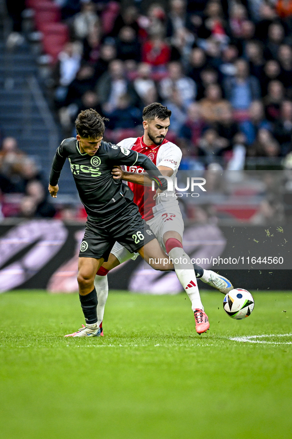 FC Groningen forward Thom van Bergen and AFC Ajax Amsterdam defender Josip Sutalo play during the match between Ajax and Groningen at the Jo...