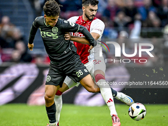 FC Groningen forward Thom van Bergen and AFC Ajax Amsterdam defender Josip Sutalo play during the match between Ajax and Groningen at the Jo...