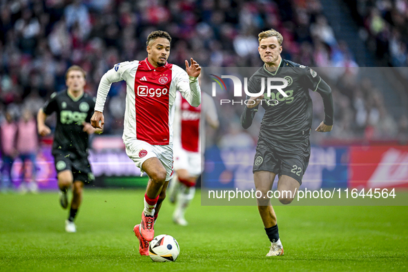 AFC Ajax Amsterdam defender Devyne Rensch and FC Groningen defender Finn Stam play during the match between Ajax and Groningen at the Johan...