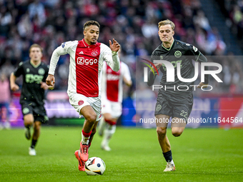 AFC Ajax Amsterdam defender Devyne Rensch and FC Groningen defender Finn Stam play during the match between Ajax and Groningen at the Johan...