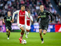 AFC Ajax Amsterdam defender Devyne Rensch and FC Groningen defender Finn Stam play during the match between Ajax and Groningen at the Johan...