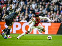 FC Groningen defender Thijmen Blokzijl and AFC Ajax Amsterdam forward Chuba Akpom play during the match between Ajax and Groningen at the Jo...