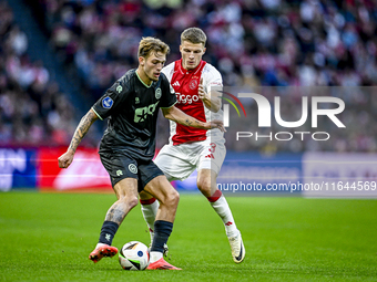 FC Groningen midfielder Luciano Valente and AFC Ajax Amsterdam defender Anton Gaaei participate in the match between Ajax and Groningen at t...