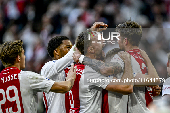 AFC Ajax Amsterdam midfielder Jordan Henderson and AFC Ajax Amsterdam forward Wout Weghorst participate in the match between Ajax and Gronin...