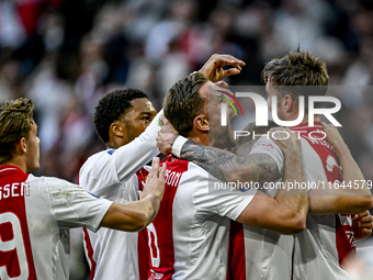 AFC Ajax Amsterdam midfielder Jordan Henderson and AFC Ajax Amsterdam forward Wout Weghorst participate in the match between Ajax and Gronin...