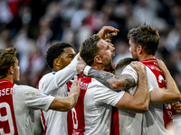 AFC Ajax Amsterdam midfielder Jordan Henderson and AFC Ajax Amsterdam forward Wout Weghorst participate in the match between Ajax and Gronin...