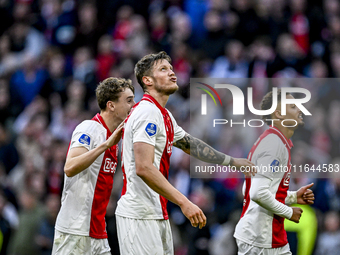 AFC Ajax Amsterdam defender Youri Baas, AFC Ajax Amsterdam forward Wout Weghorst, and AFC Ajax Amsterdam defender Devyne Rensch participate...