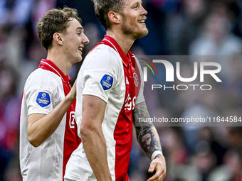 AFC Ajax Amsterdam defender Youri Baas and AFC Ajax Amsterdam forward Wout Weghorst participate in the match between Ajax and Groningen at t...